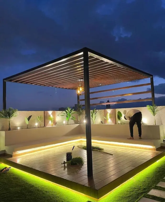 Outdoor pergola seating area with hanging garden lights