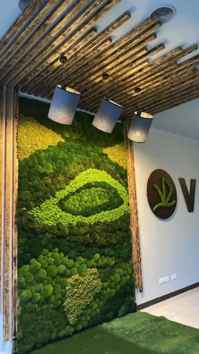 Indoor vertical garden wall with logo lighting at entrance