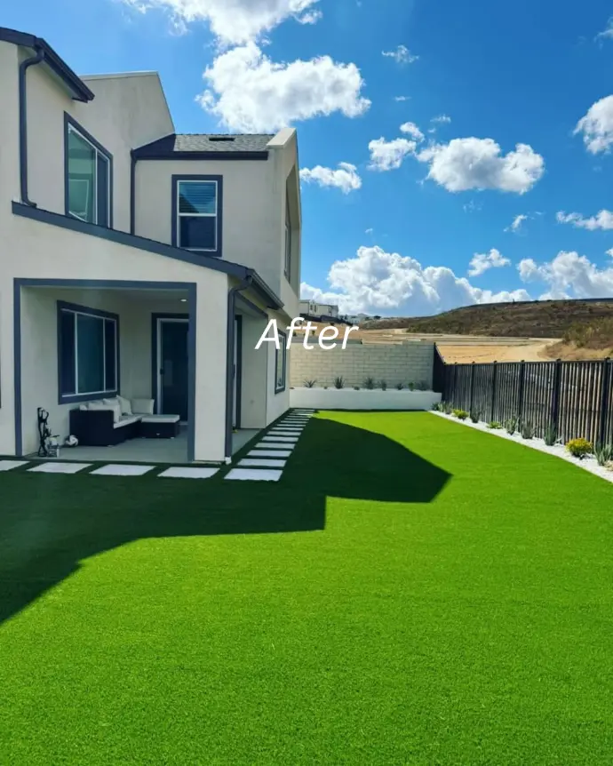 Newly constructed house with green lawn and minimal plants