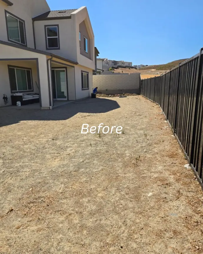 Gravel-filled backyard area ready for landscaping work